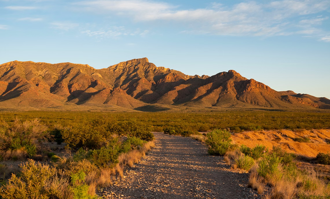 golden hour desert landscape at franklin mountains state park el paso texas with rocky ridgeline desert scrub and dirt trail