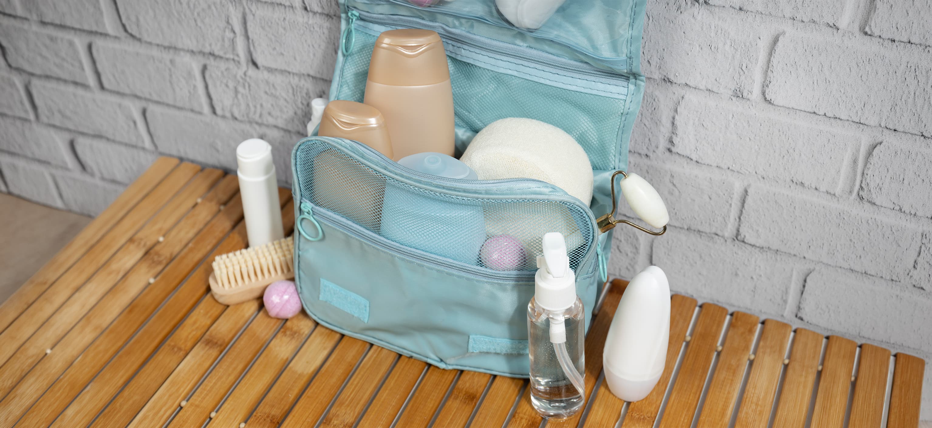Oversized toiletry kit overflowing with bottles and accessories