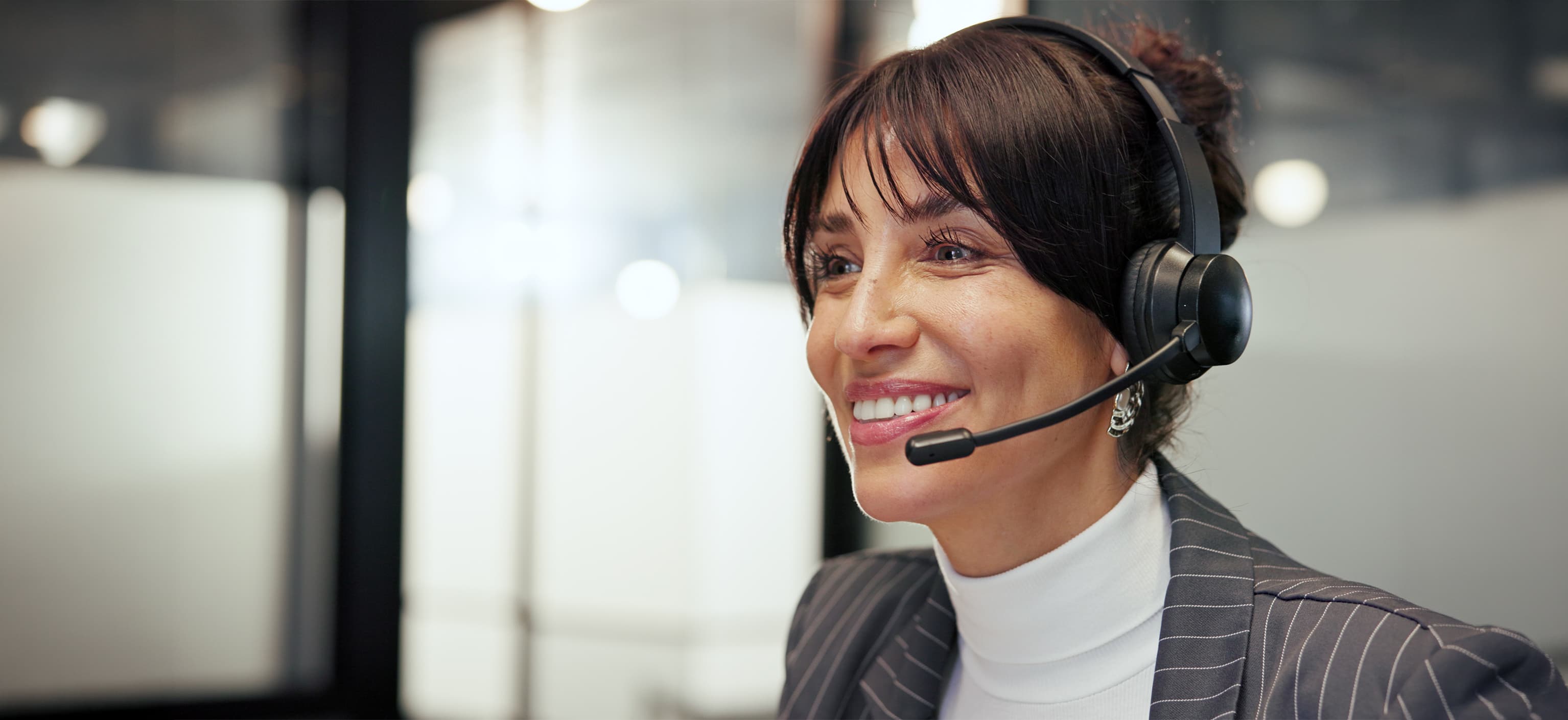 Smiling customer support agent wearing a headset